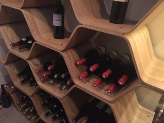 Wine tasting in paris, france. Wine bottles on a shelf
