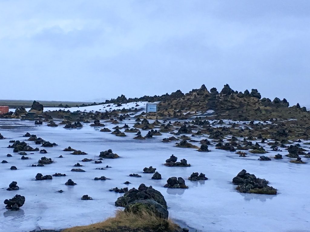 stone cairns at Laufskálavarða in Iceland covered in snow