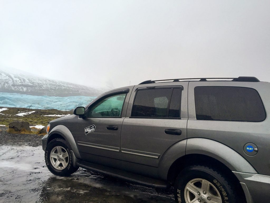 gray campervan in an icy road in Iceland