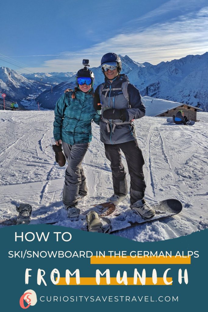 A man and a woman posing for a photo on top of a ski slope while standing on snowboards. Text in the bottom says "How to ski/snowbaord in the German Alps from Munich" and "Curiositysavestravel.com"