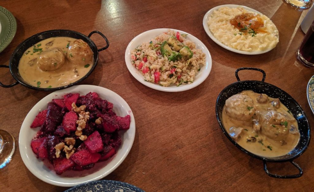 A table with five different dishes of German cuisine.