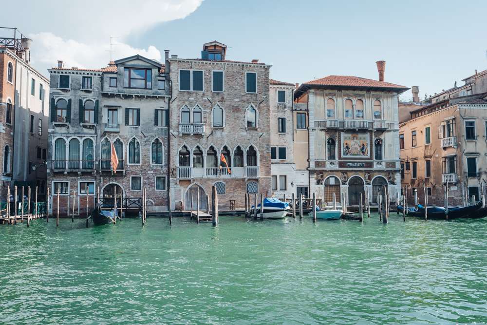 venice canal lined with historic buildings