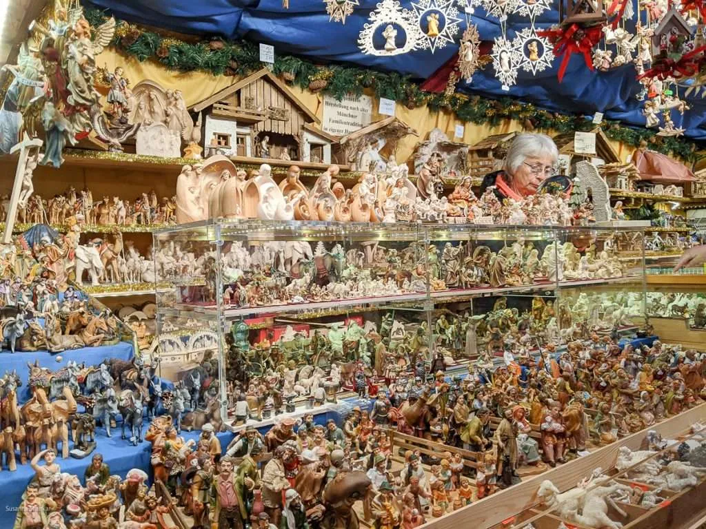 A Christmas market stall packed with beautiful Nativity figurines.