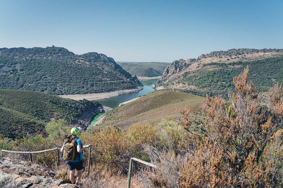 Woman looks at the view over Monfragüe National Park Green hiking trail