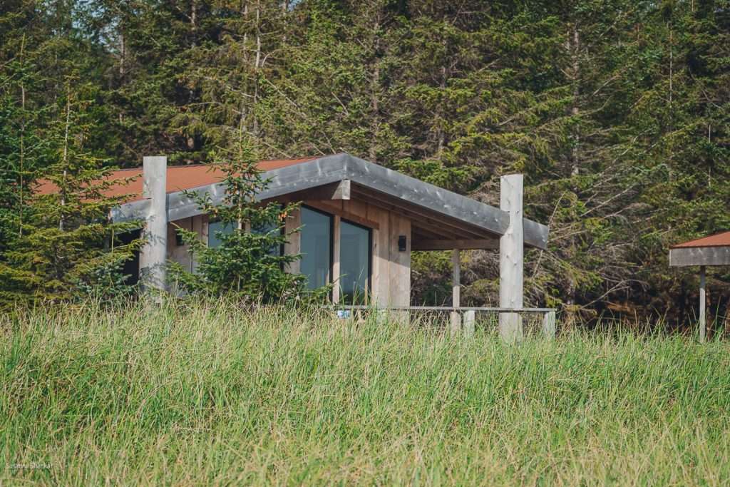 Cabin tucked away behind sand dunes and in the forest