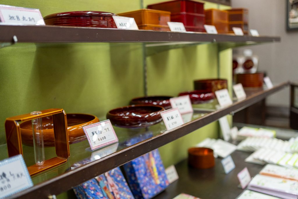 A close-up of shelves of lacquerware souvenirs for sale in Takayama, Japan.