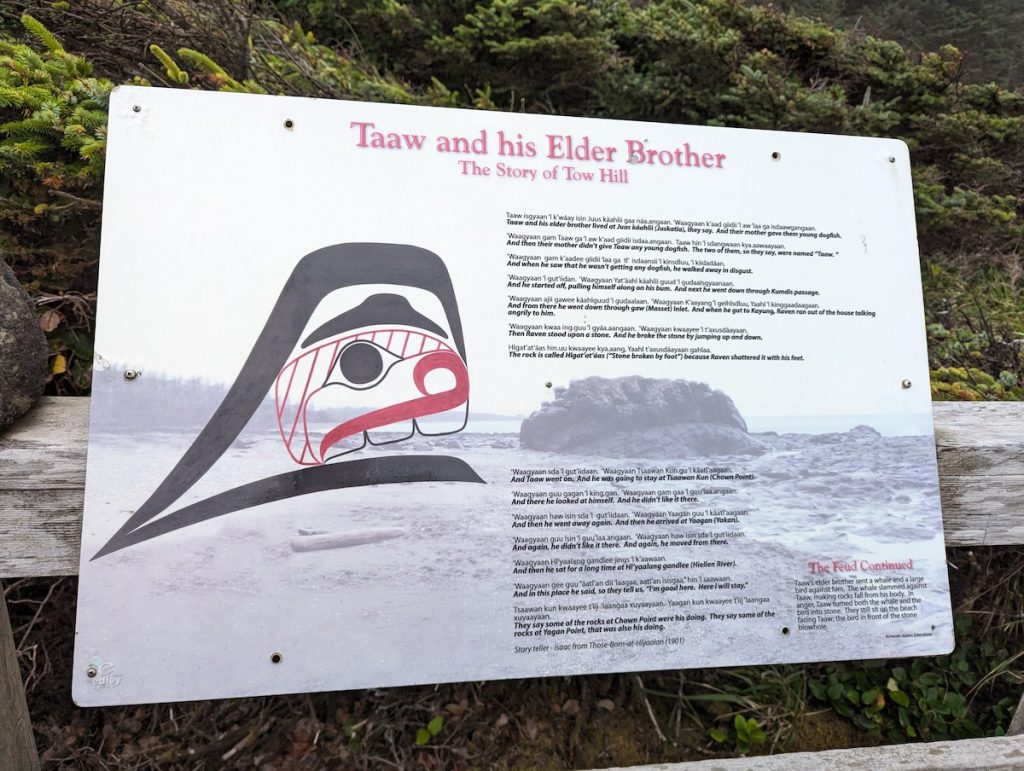 An informational sign on a walking track telling the story of "Taaw and his Elder Brother" on Haida Gwaii.