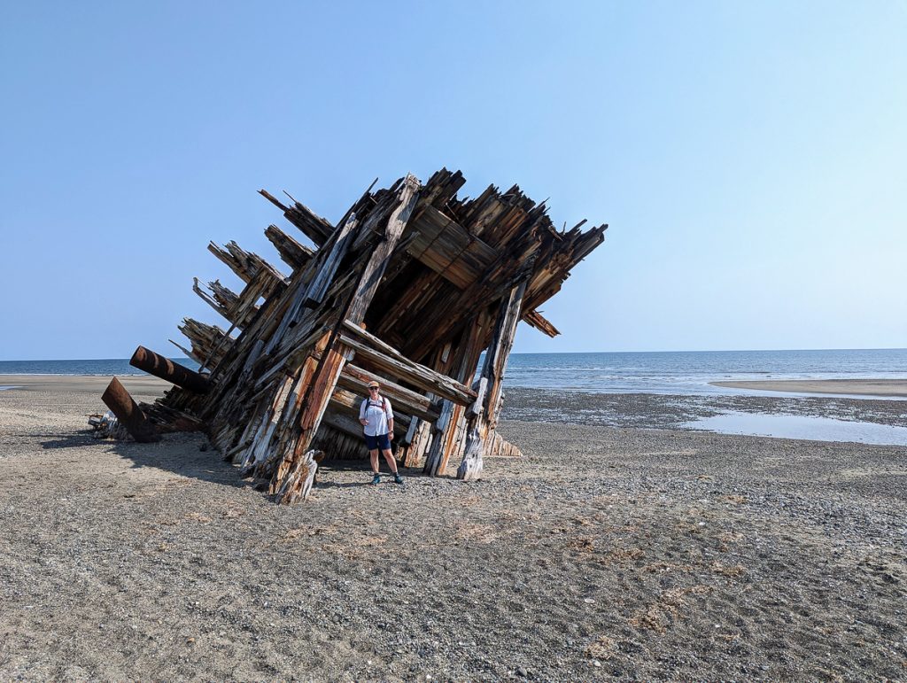 An old wooden WWII era ship wrecked on the beach in Haida Gwaii