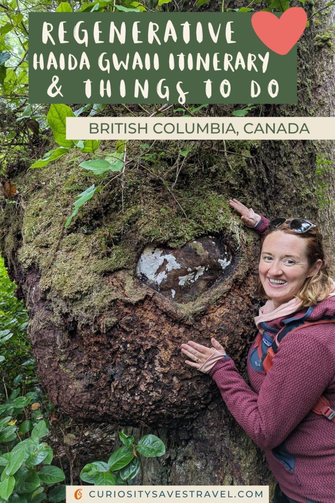 A photo of a woman smiling at the camera with her hands on a large mossy tree trunk, with text over the top that reads "Regenerative Haida Gwaii itinerary & things to do British Columbia, Canada."