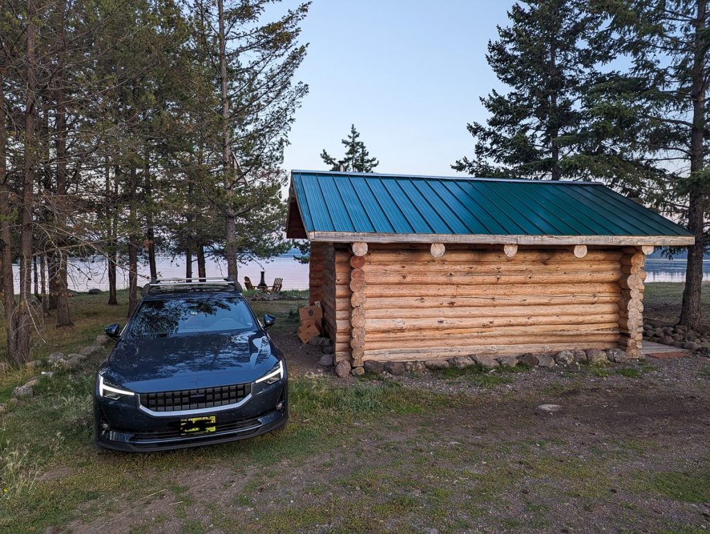 a car in front of a little farm house during an EV road trip