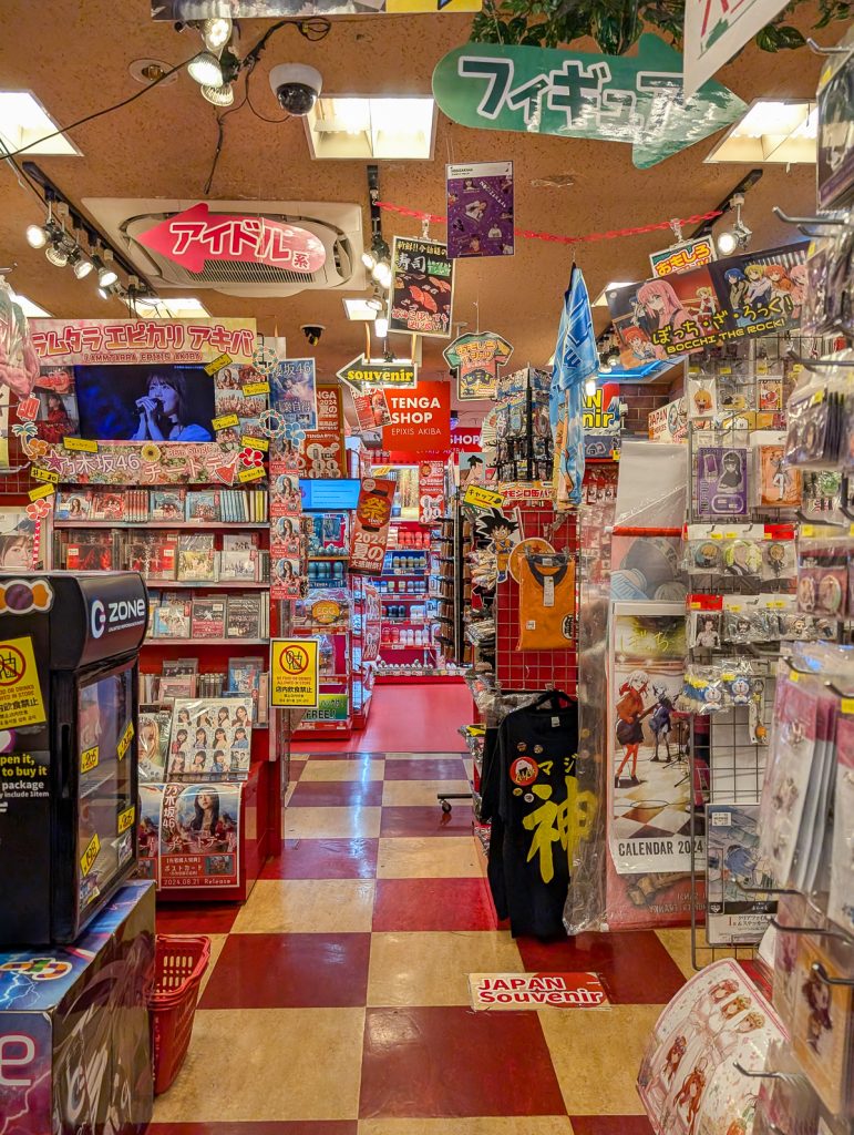 A souvenir shop in Japan with racks of magazines, stickers, toys, and more.