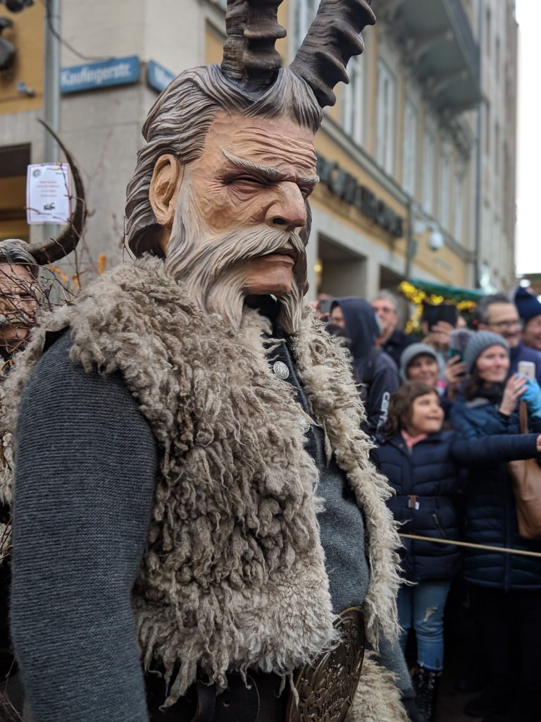 A costumed man depicting an alternative Christmas man in the Krampus run