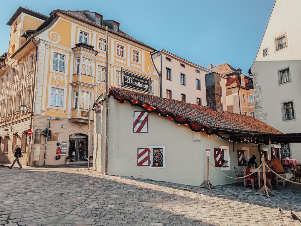 historic buildings in Regensburg, Germany decorated for Christmas