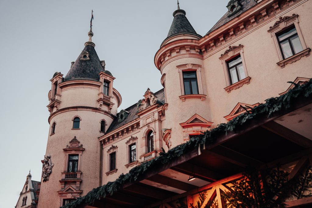 A palatial building with round towers.
