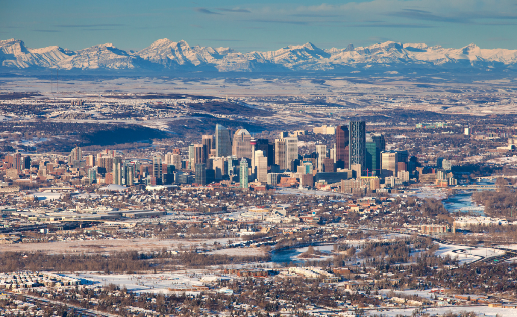 Calgary in winter the skyline aerial view with the Rockies in the distance
