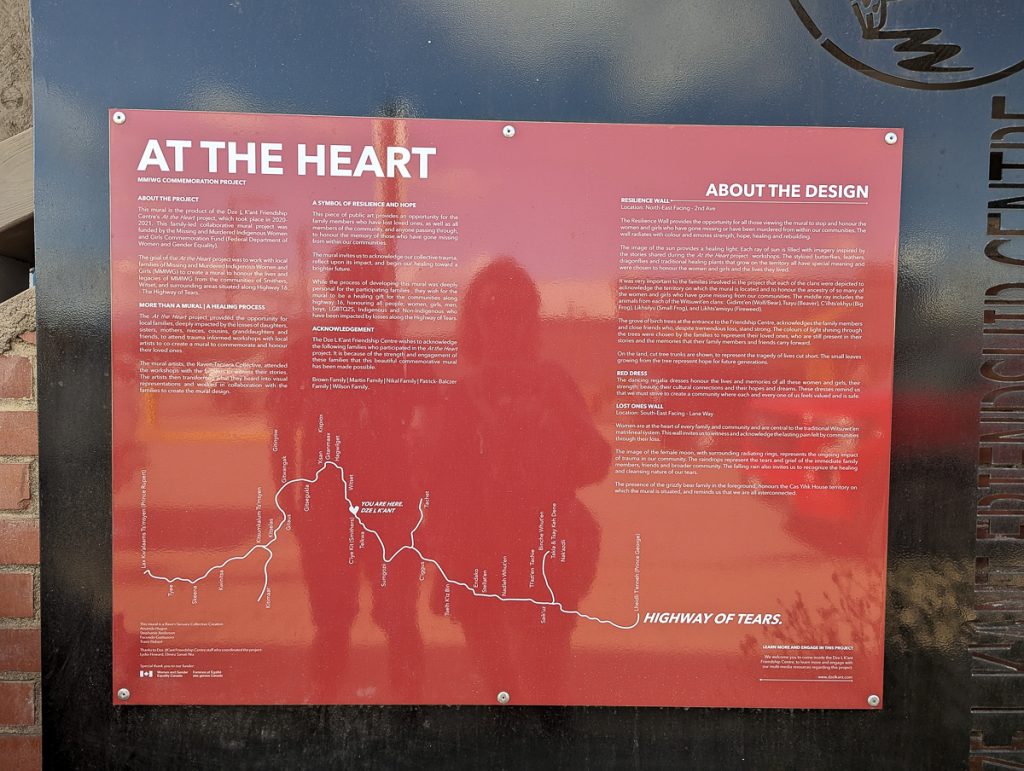 A red board with white text and a map about the Highway of Tears in Canada.