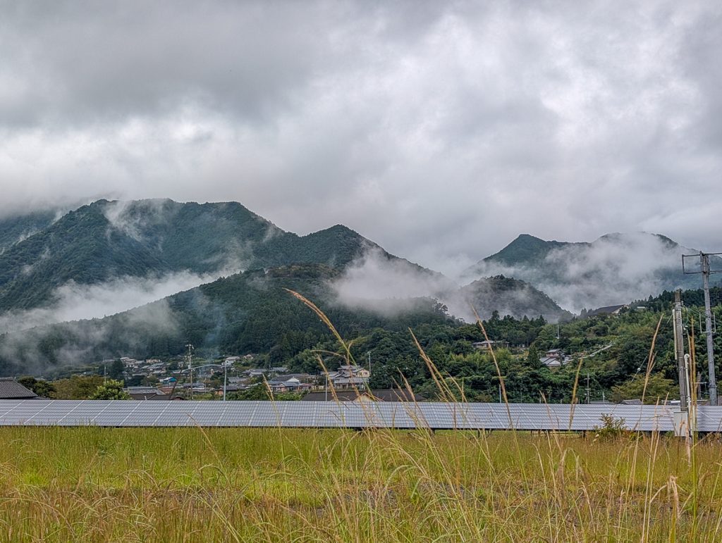Views of the bus from the Kumano Kodo with mountains and a river. 