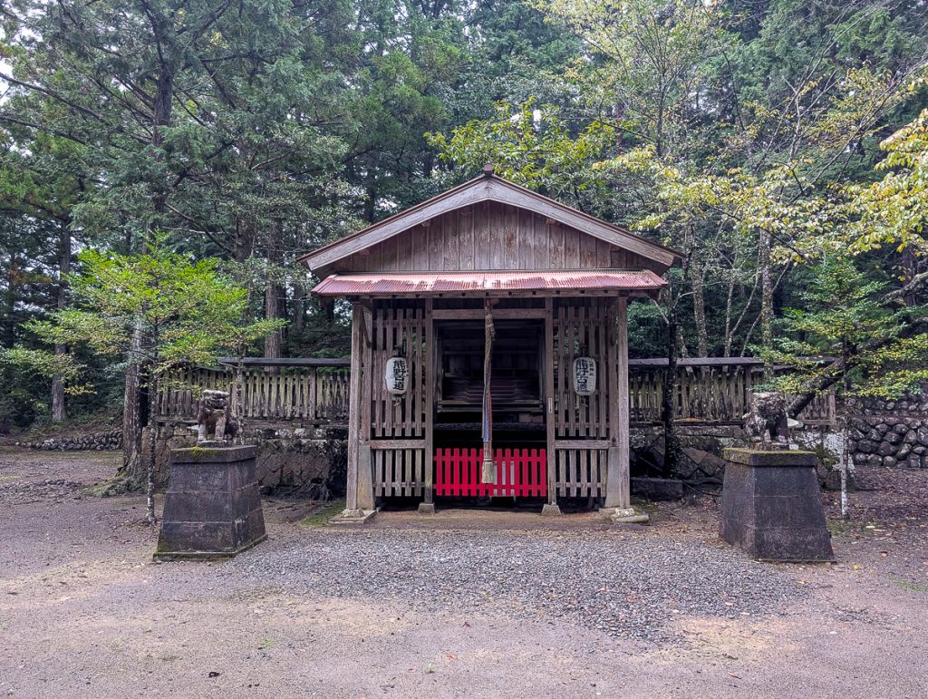 A small wooden Japanese shrine on the Kumano Kodo