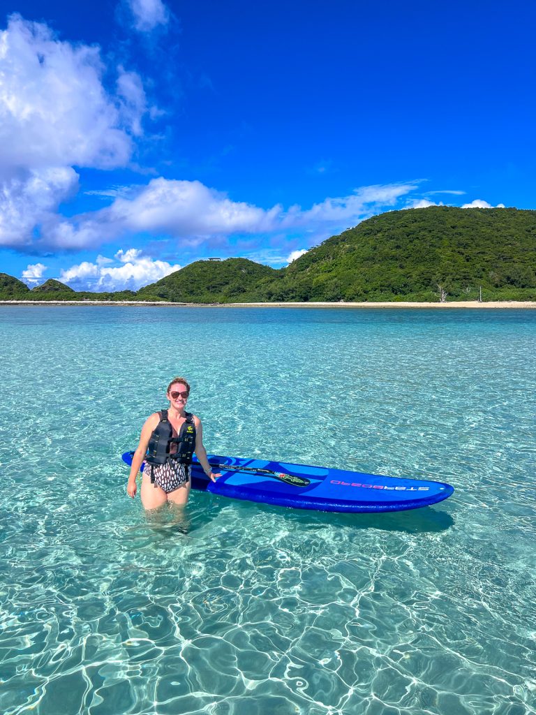 Susanna stands on a sand bar in Keramashoto Okinawa water