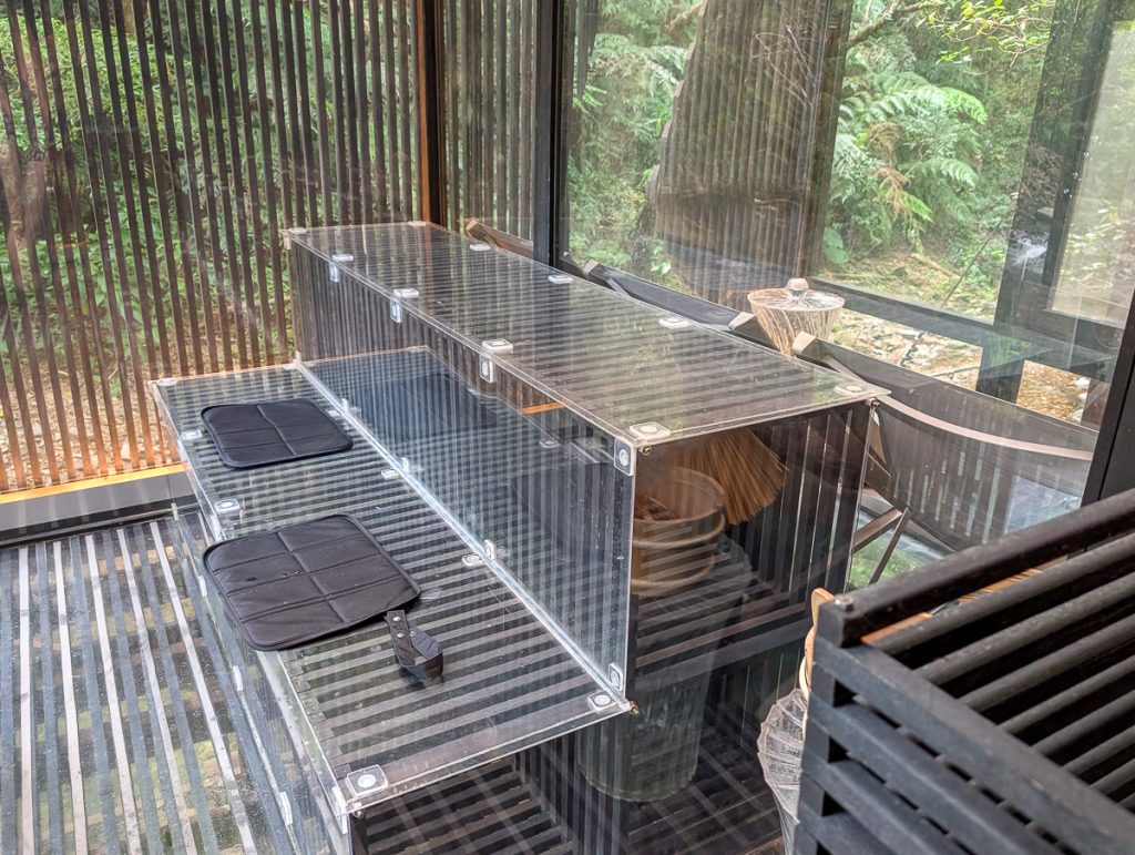 A glass house sauna at Treeful Treehouse