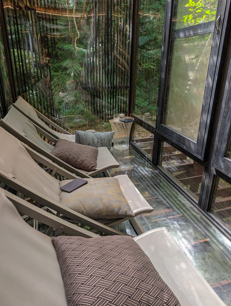 Relaxing sauna chairs in a glass sunroom