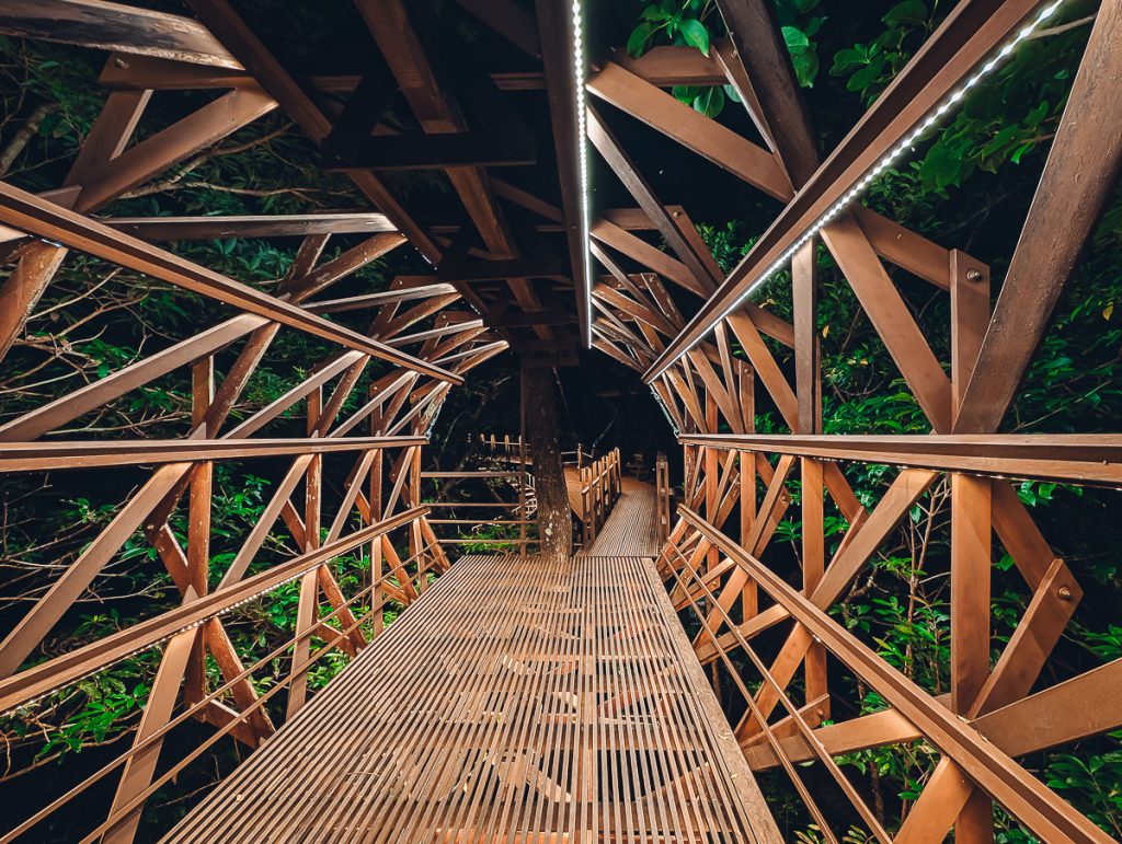 A wooden entrance into Treeful Treehouse sustainable resort