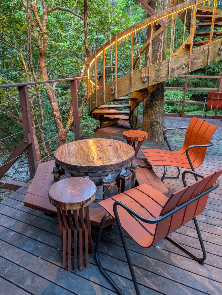 wooden table and chairs on a deck