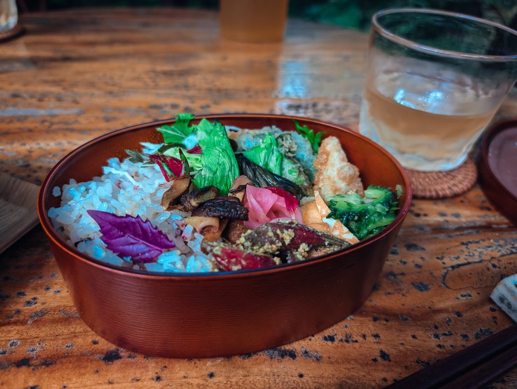 a vegan bento box full of rice and vegetables