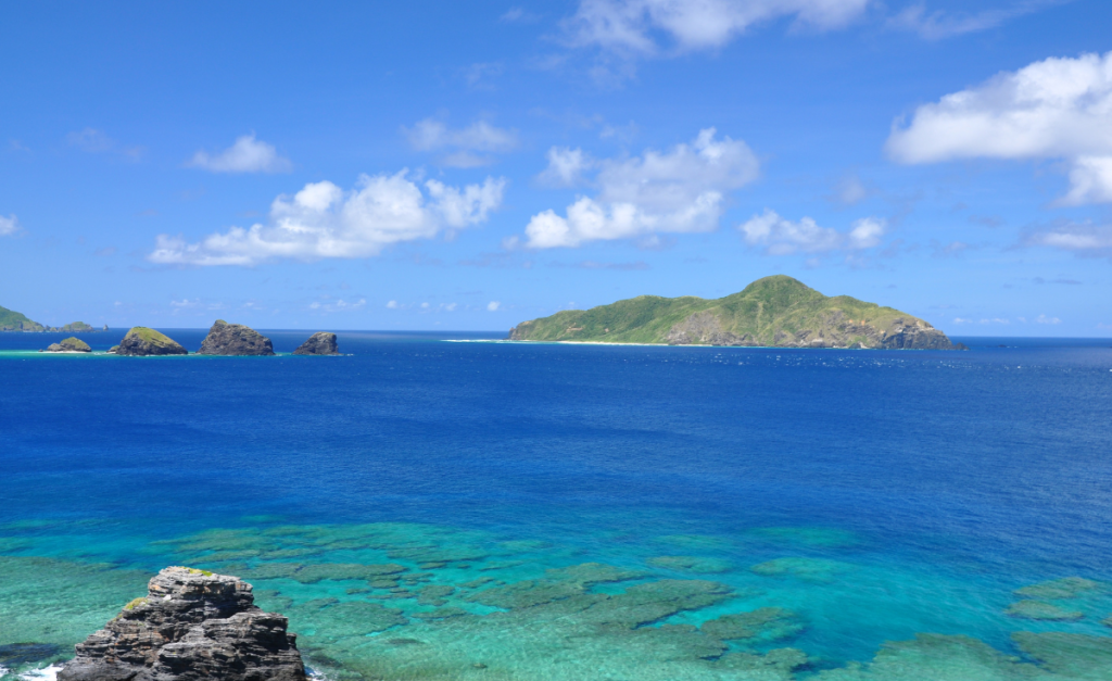 Endless blue water with visible coral reef under water in Okinawa, Japan
