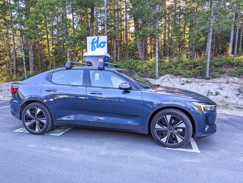 a car is parked at an EV charger