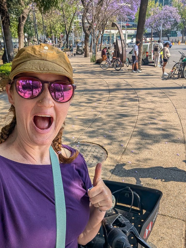 Sooz gives a thumbs up after getting a bike