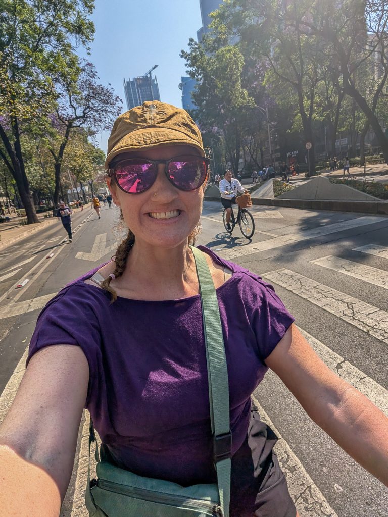 Sooz takes a self riding a bike in Mexico City's bike Sunday program