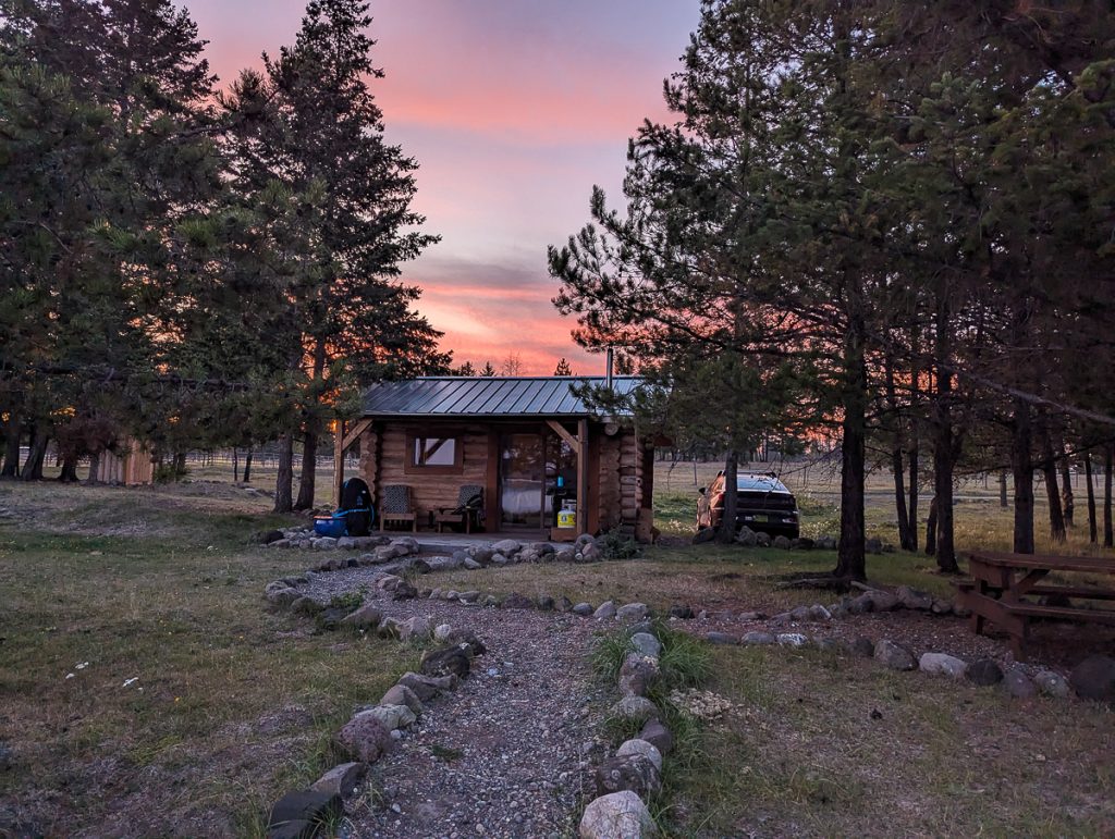 a cabin at sunset