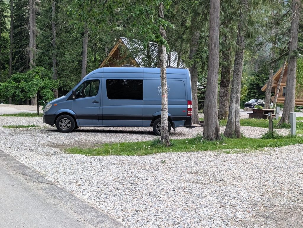 A blue Campervan at Boulder Mountain Resort in revelstoke