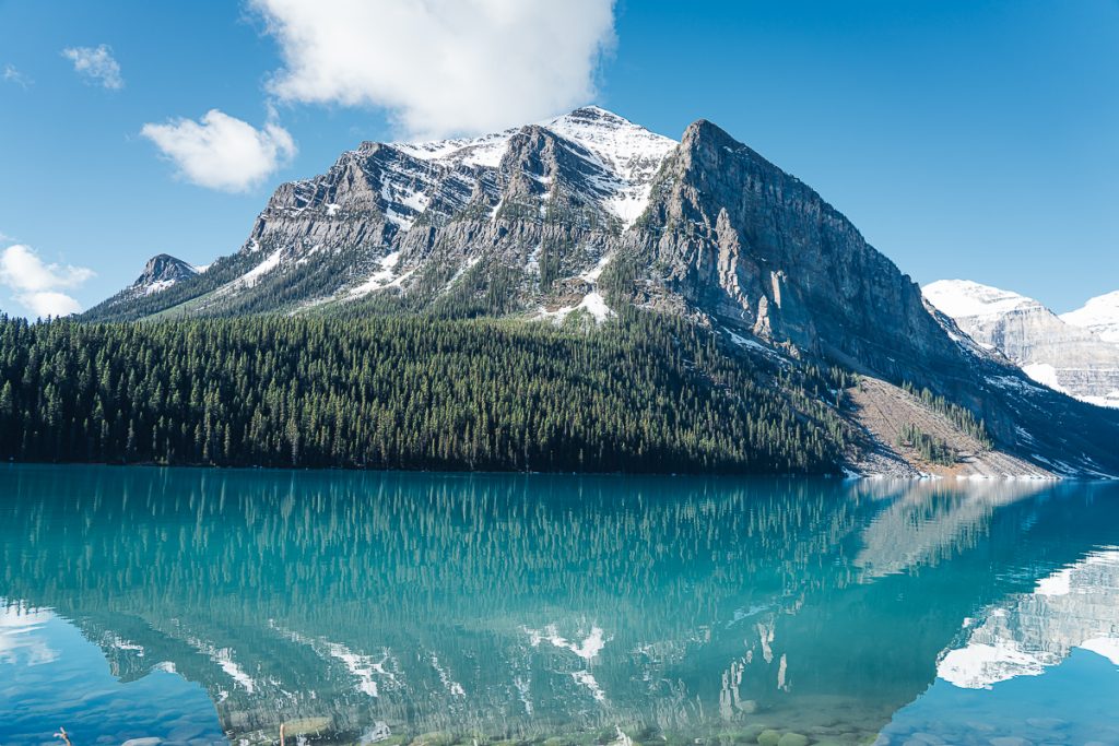 A snow capped mountain and glacial Lake Louise