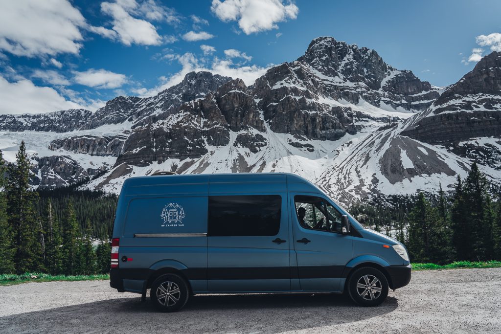 A blue campervan on the Icefields Parkway