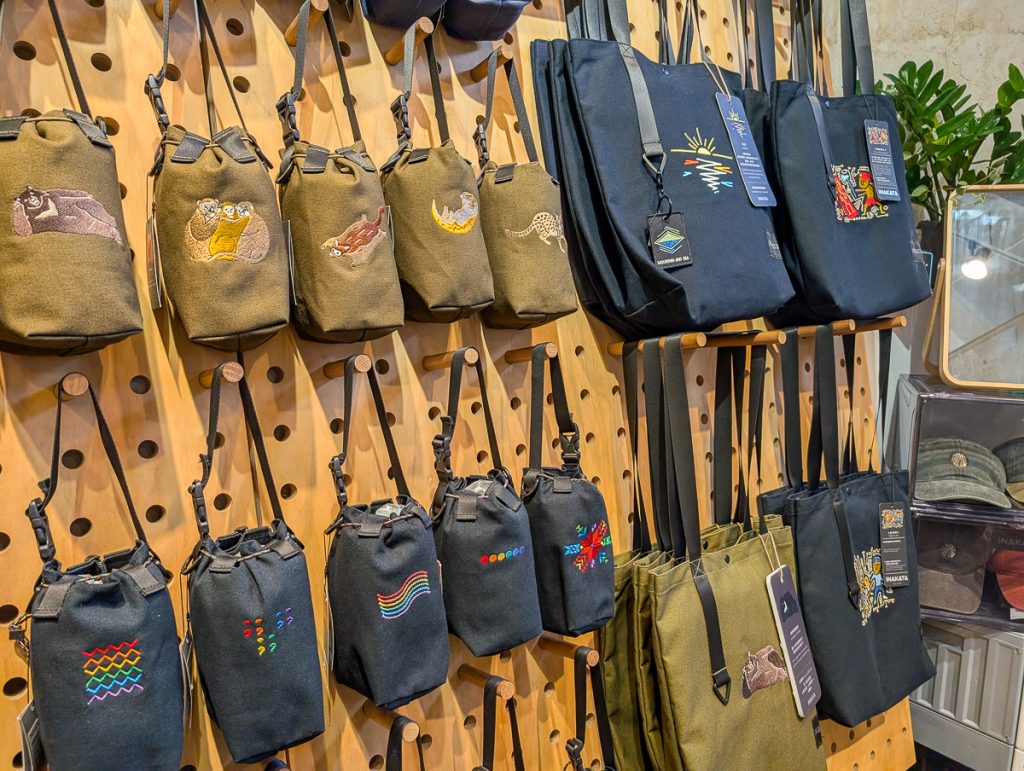 A display in a shop of cool embroidered bags.