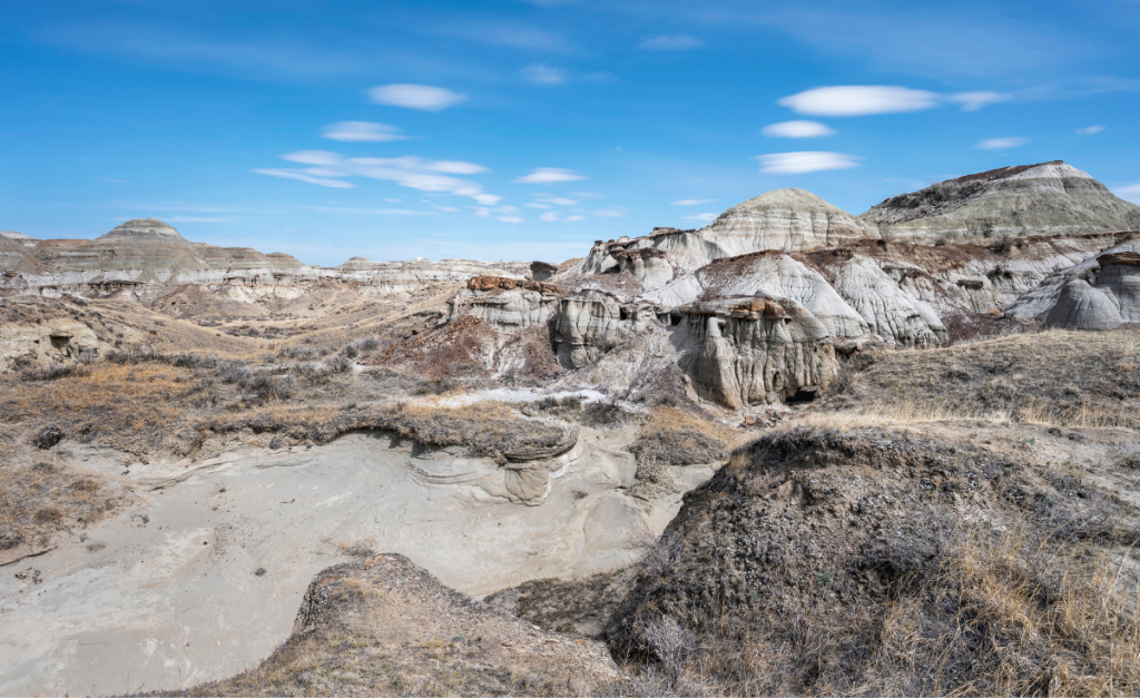A arid badland landscape with rock formations in Dinosaur Provincial Park