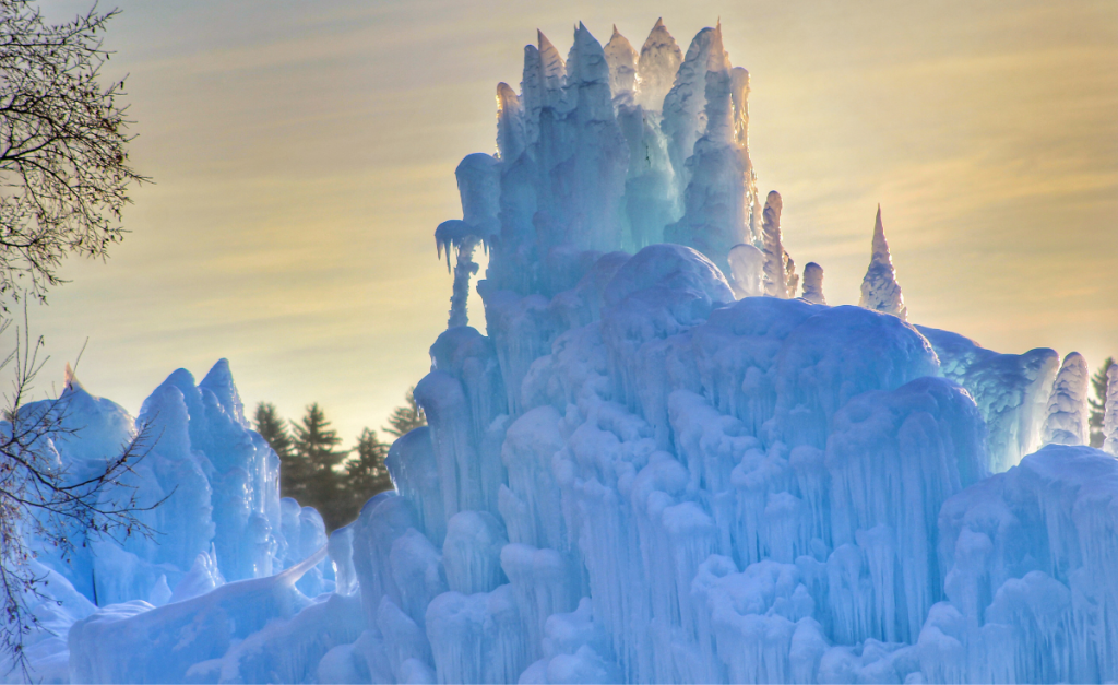An ice formation that looks like a caste, under a golden sky.