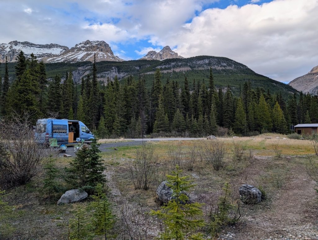A blue campervan at Silverhorn campsite on the Icefields Parkway