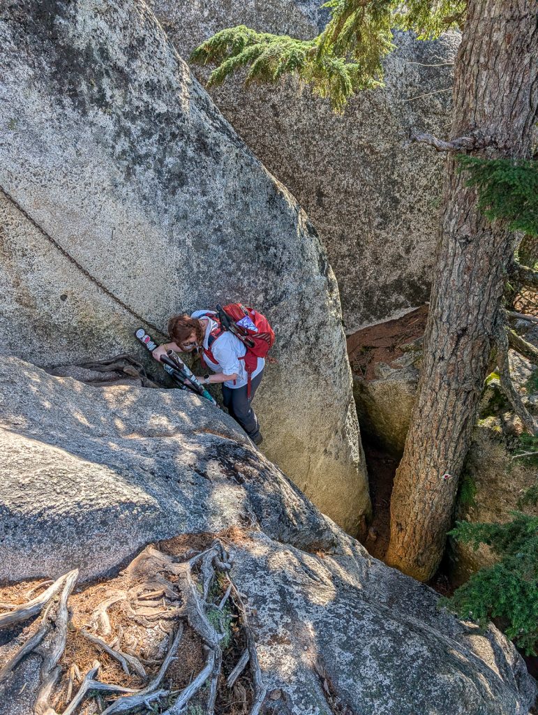 A woman climbing down on a rope assist