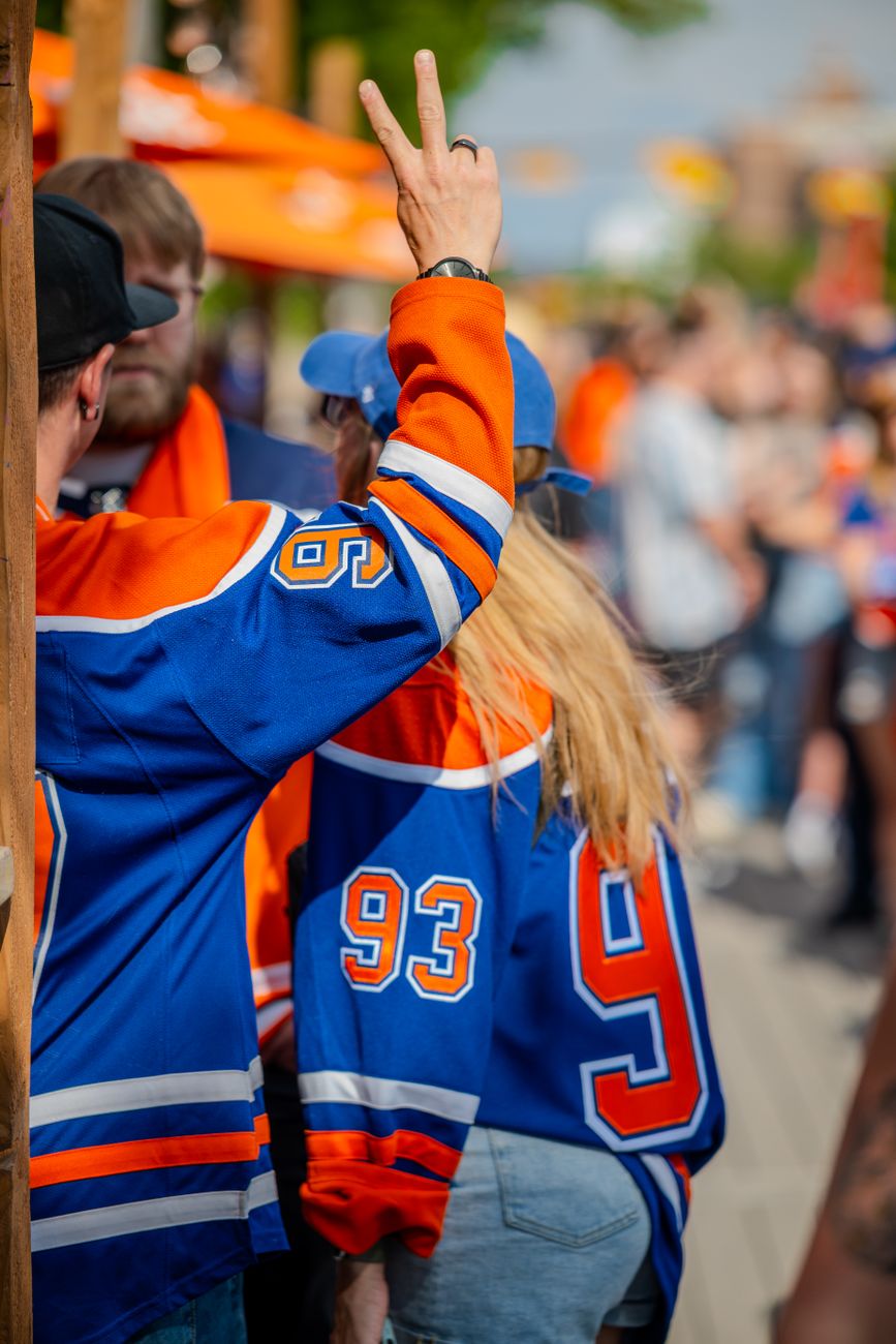 fans wearing blue jerseys at outdoor sports event